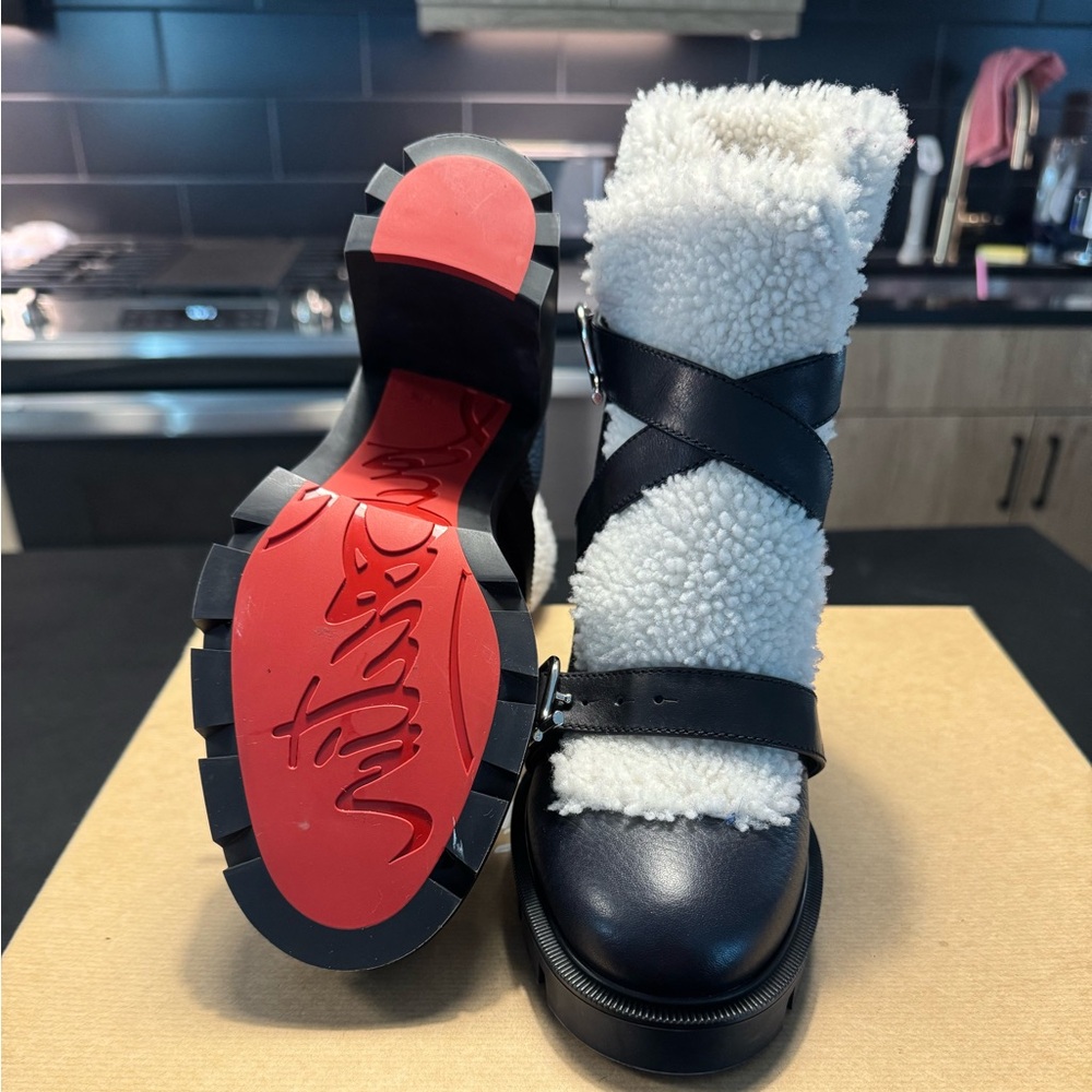 Brand new Christian Louboutin boots. Size 38.5. Comes with box.